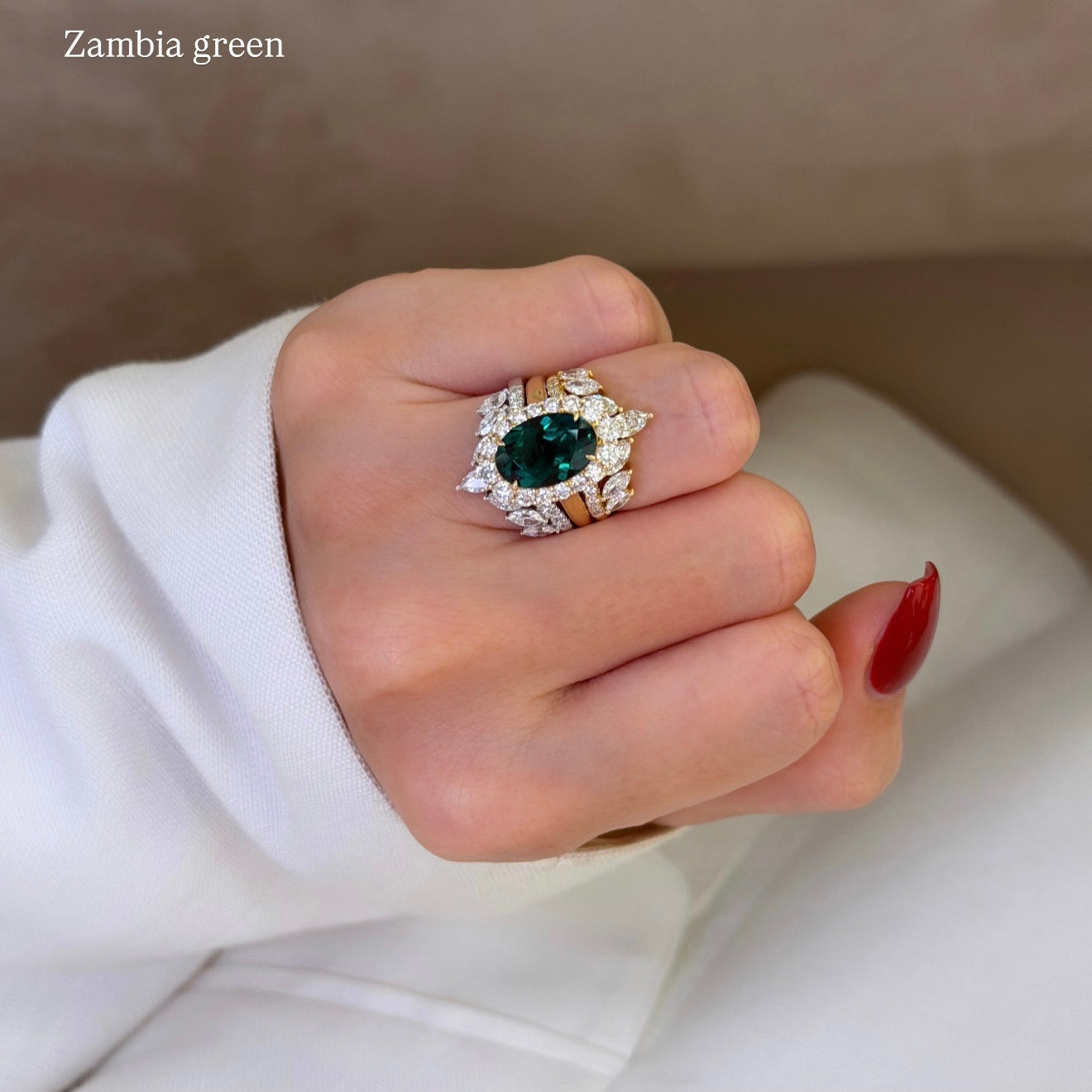 Gloria 3ct Oval Lab-Grown Zambian Green Emerald Trio Set with Dual Isabella V-Shaped Diamond Bands in 14K Gold, 18K Gold, or Platinum by Earthena Jewelry of Beverly Hills.
