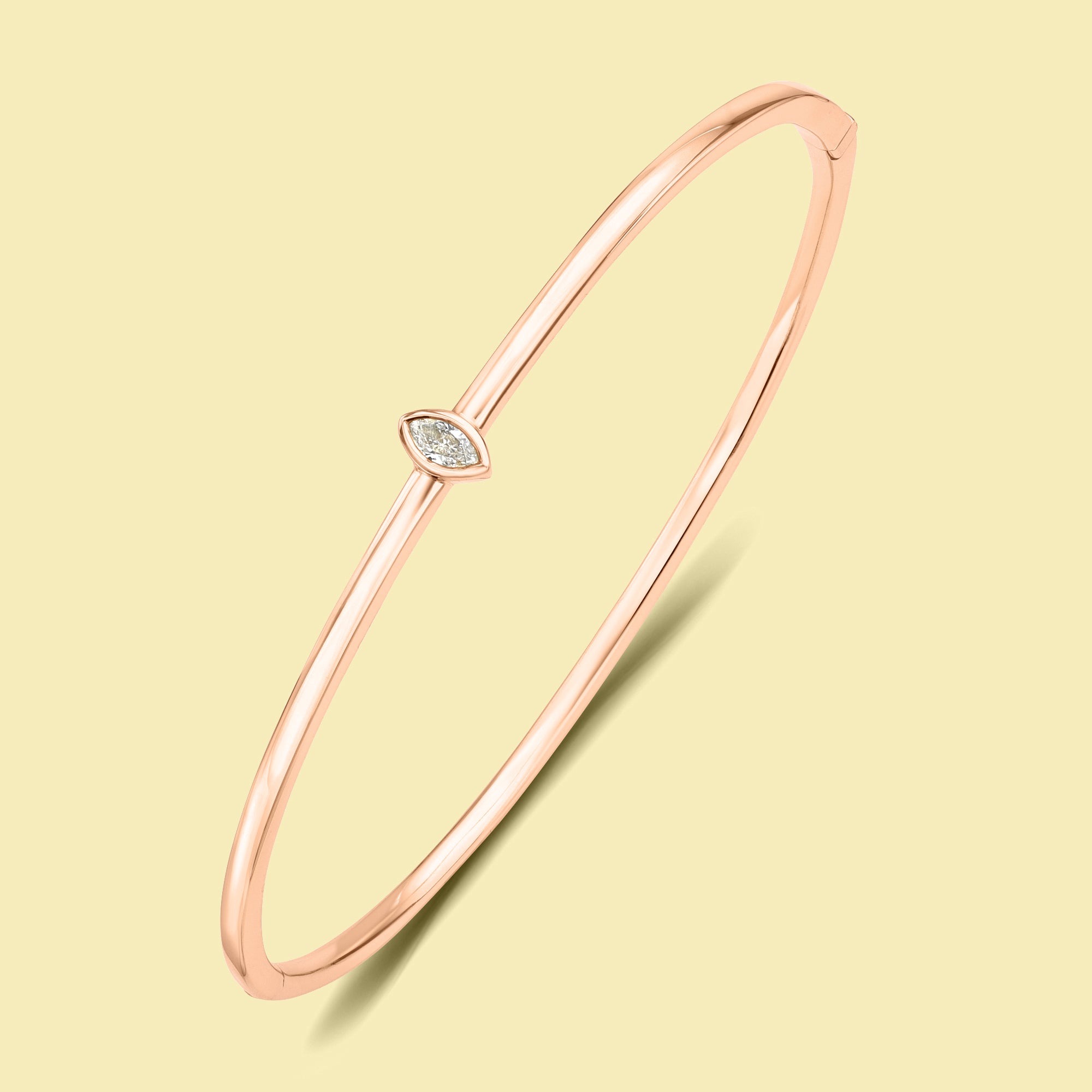 The Charlotte, Marquise-cut Lab-grown and Natural diamond Bezel Solitaire Bangle handcrafted 14K gold, 18K gold and Platinum by Earthena Jewelry