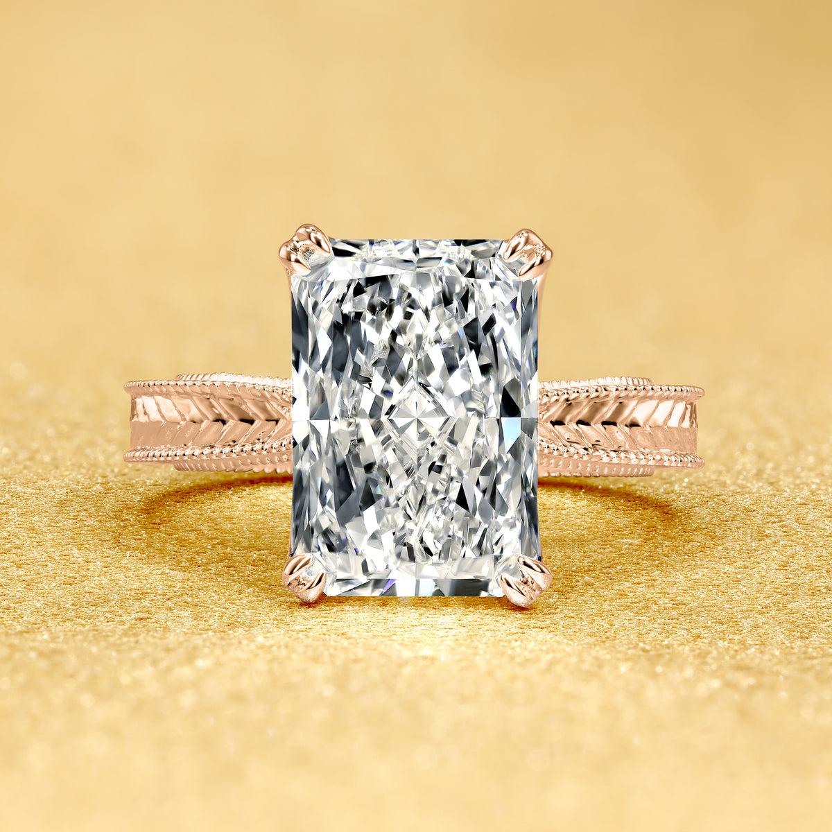 The Elizabeth, 4ct Elongated Radiant-Cut Lab-Grown Diamond Engraved 4-Prong Tulip Engagement Ring in 14K Gold, 18K Gold, or Platinum by Earthena Jewelry of Beverly Hills.