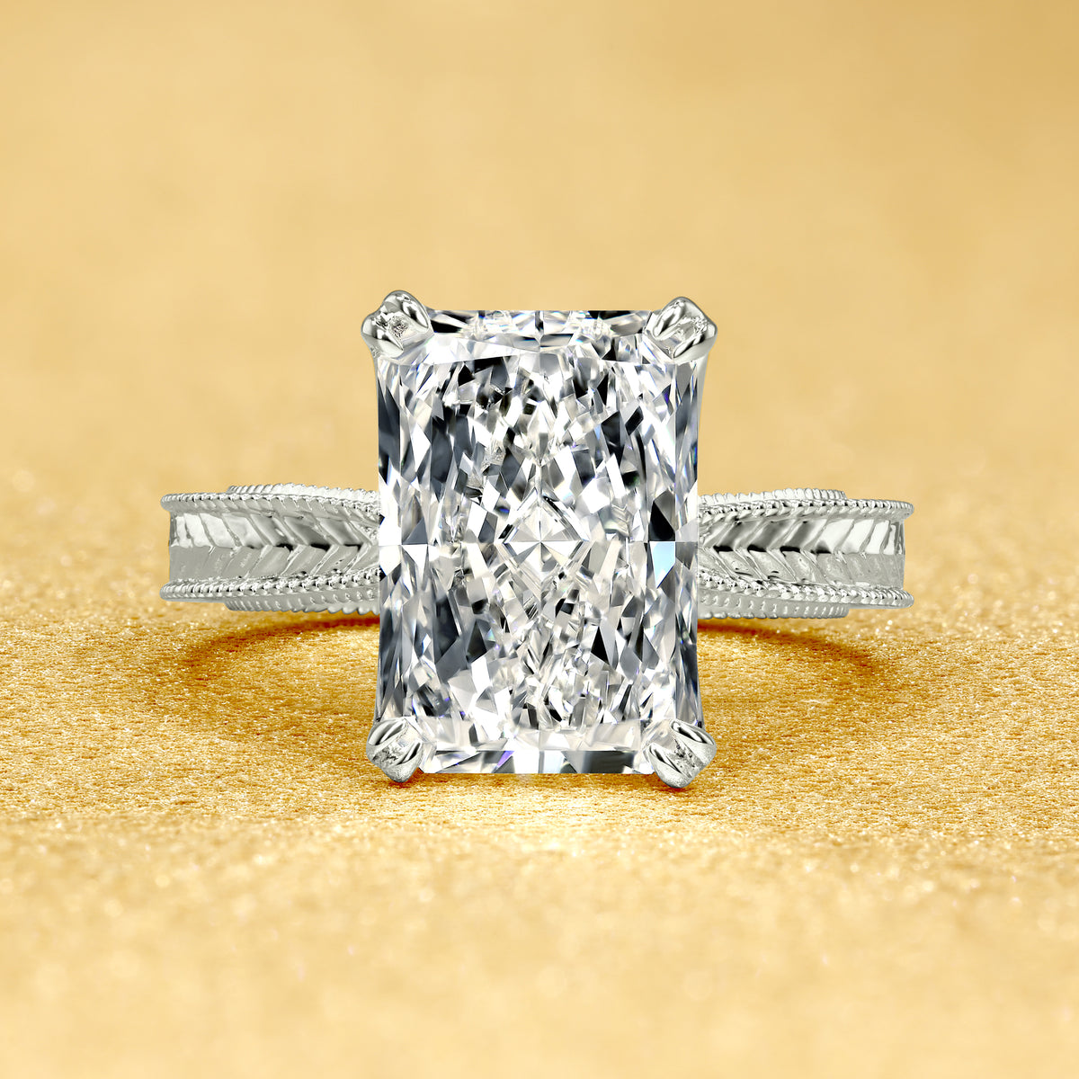 The Elizabeth, 4ct Elongated Radiant-Cut Lab-Grown Diamond Engraved 4-Prong Tulip Engagement Ring in 14K Gold, 18K Gold, or Platinum by Earthena Jewelry of Beverly Hills.