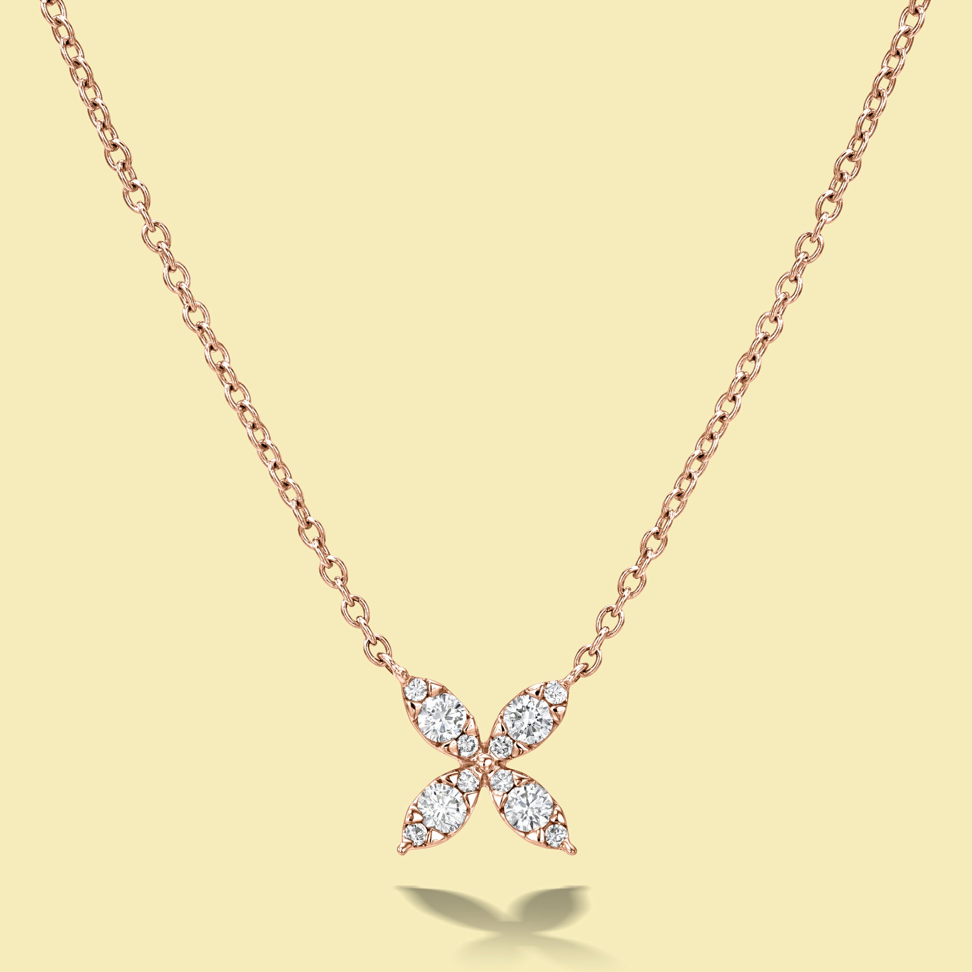 The Flora, Classic Four Petal Diamond Necklace is handcrafted in 14K Gold, 18K Gold, or Platinum by Earthena Jewelry in Los Angeles