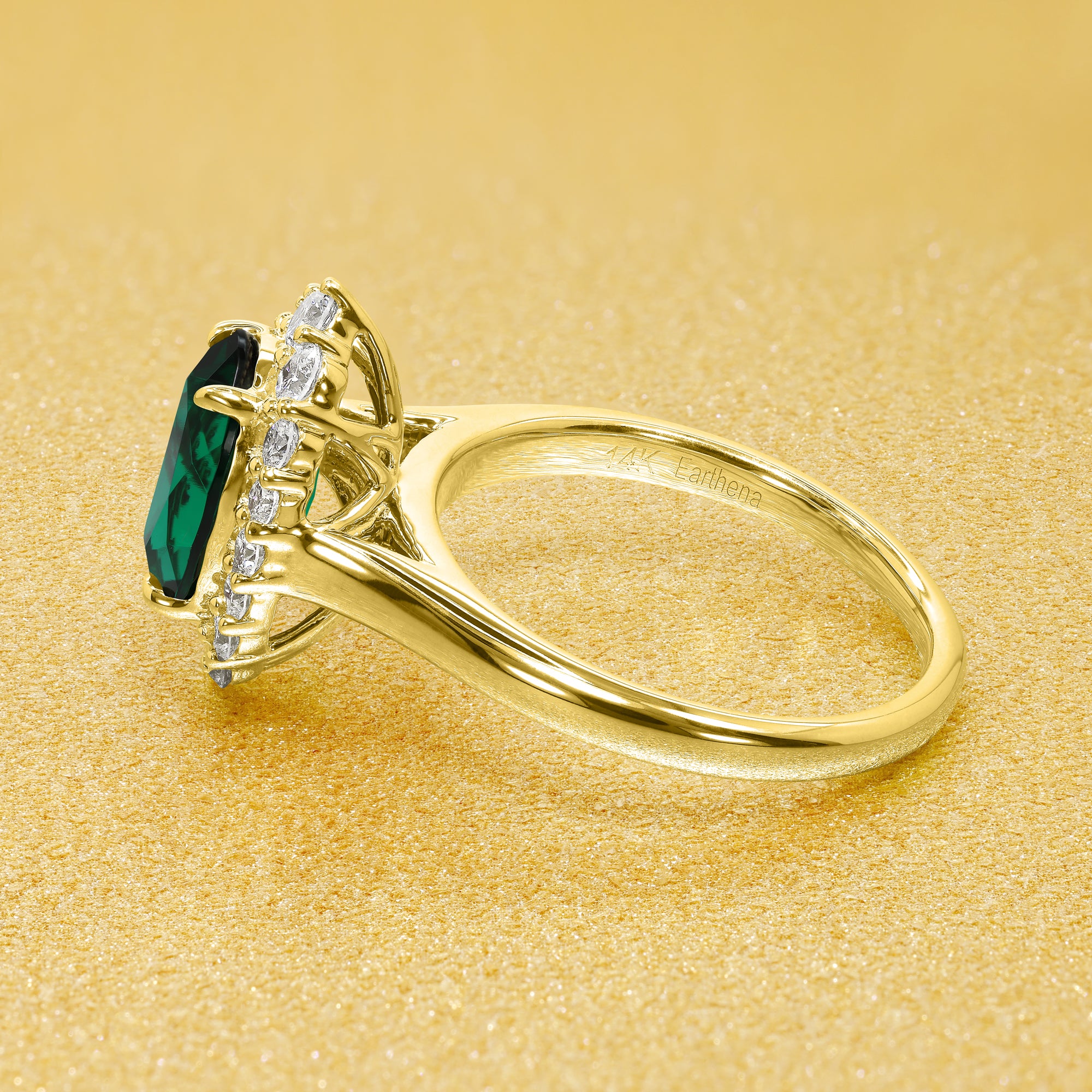 Gloria 1.5ct Elongated Lab-grown Oval-cut Green Emerald Halo Cathedral Engagement Ring in 14K Gold, 18K Gold, or Platinum by Earthena Jewelry of Beverly Hills.