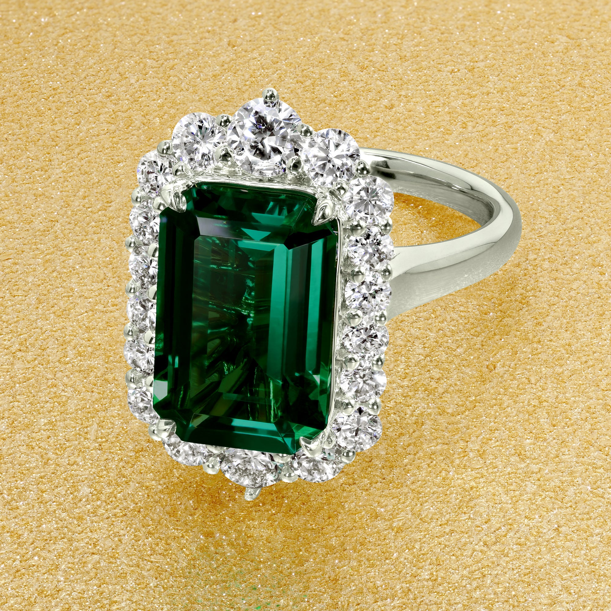 Gloria 3.5ct Emerald-Cut Lab-Grown Zambia Green Emerald Halo Cathedral Engagement Ring in 14K Gold, 18K Gold, or Platinum by Earthena Jewelry of Beverly Hills.
