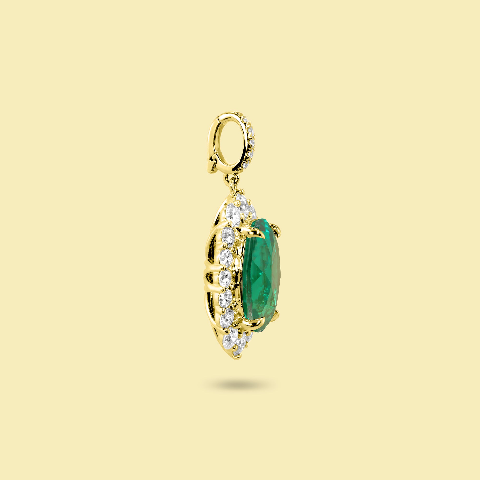 Gloria 3ct Oval-Cut Colombian Green Lab-Grown Emerald Halo Charm Pendant in 14K Gold, 18K Gold, or Platinum by Earthena Jewelry of Beverly Hills.