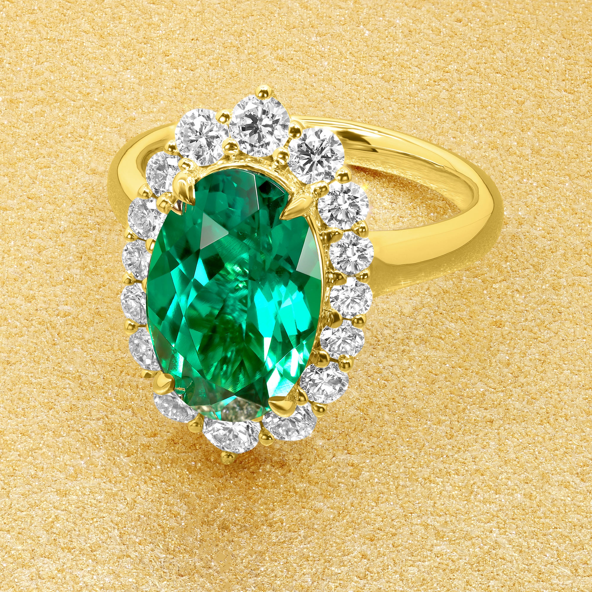 Gloria 3ct Elongated Lab-grown Oval-cut Vivid Green Emerald Halo Cathedral Engagement Ring in 14K Gold, 18K Gold, or Platinum by Earthena Jewelry of Beverly Hills.