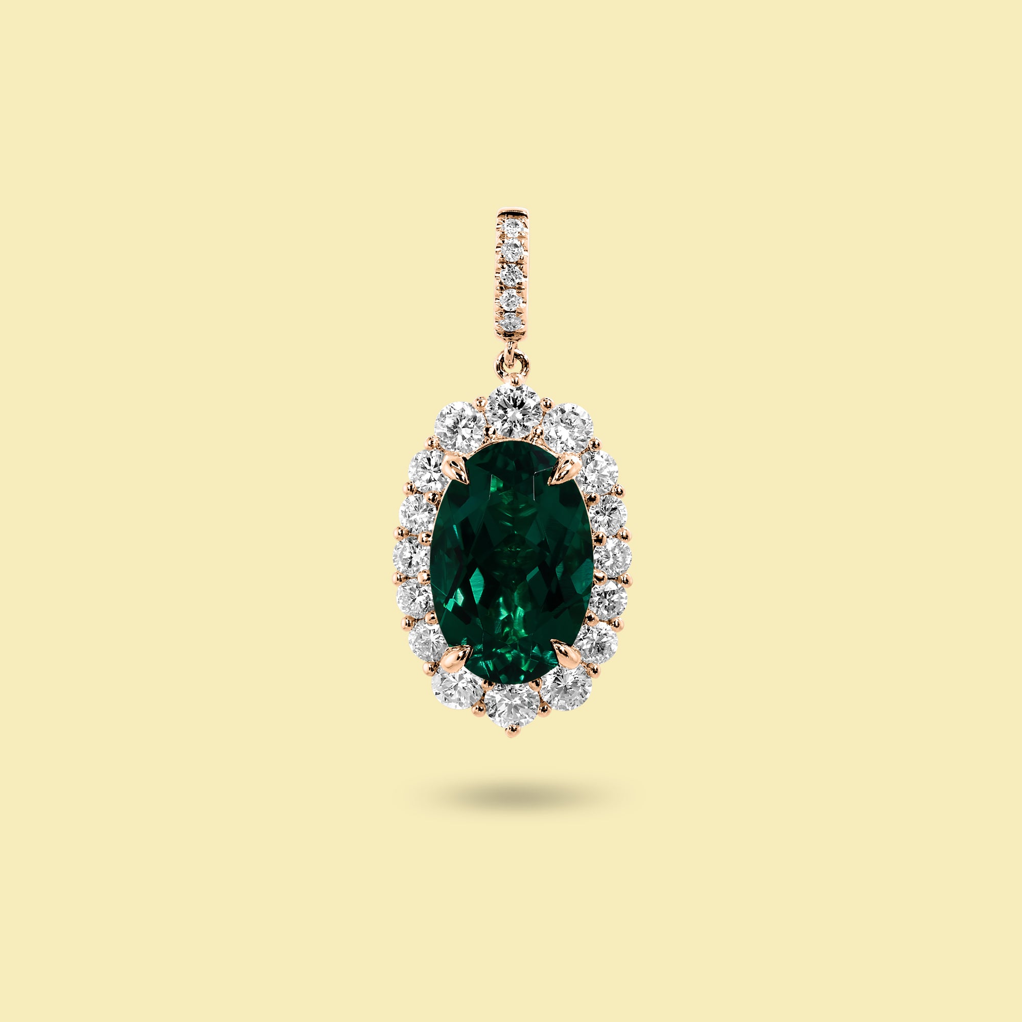 Gloria 3ct Oval-Cut Zambian Green Lab-Grown Emerald Halo Charm Pendant in 14K Gold, 18K Gold, or Platinum by Earthena Jewelry of Beverly Hills.