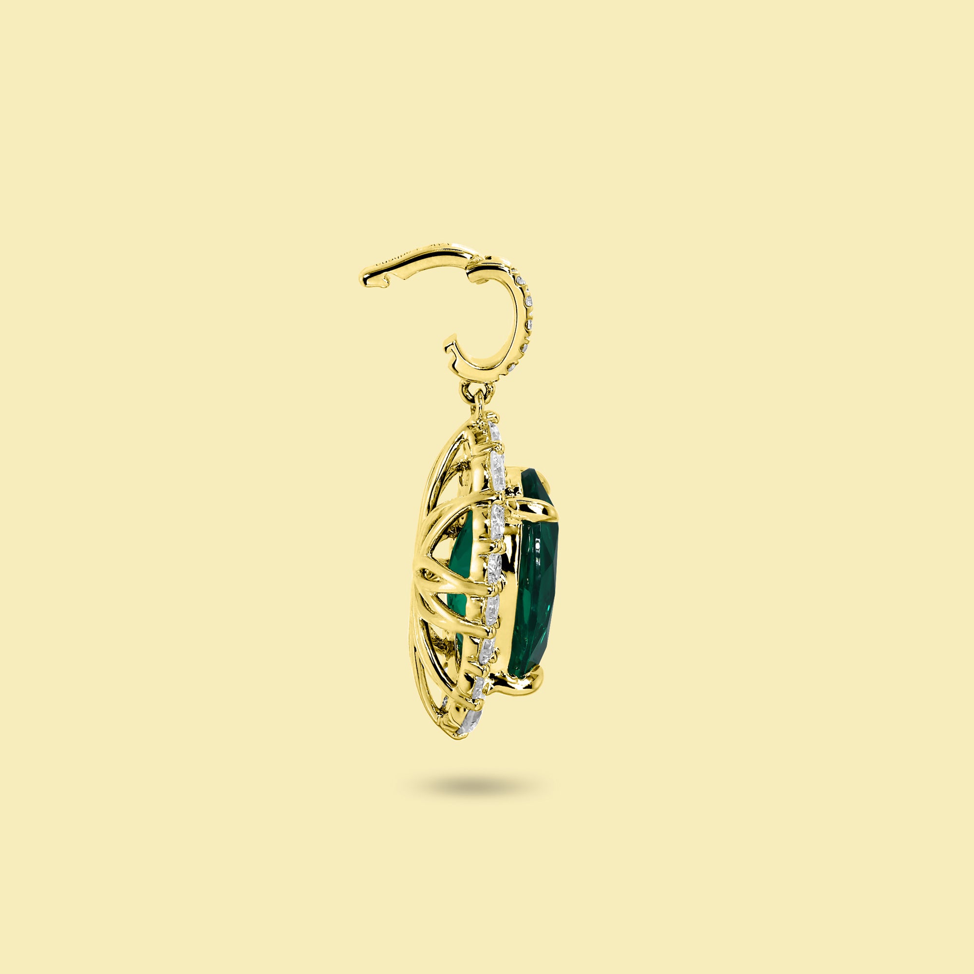 Gloria 3ct Oval-Cut Zambian Green Lab-Grown Emerald Halo Charm Pendant in 14K Gold, 18K Gold, or Platinum by Earthena Jewelry of Beverly Hills.