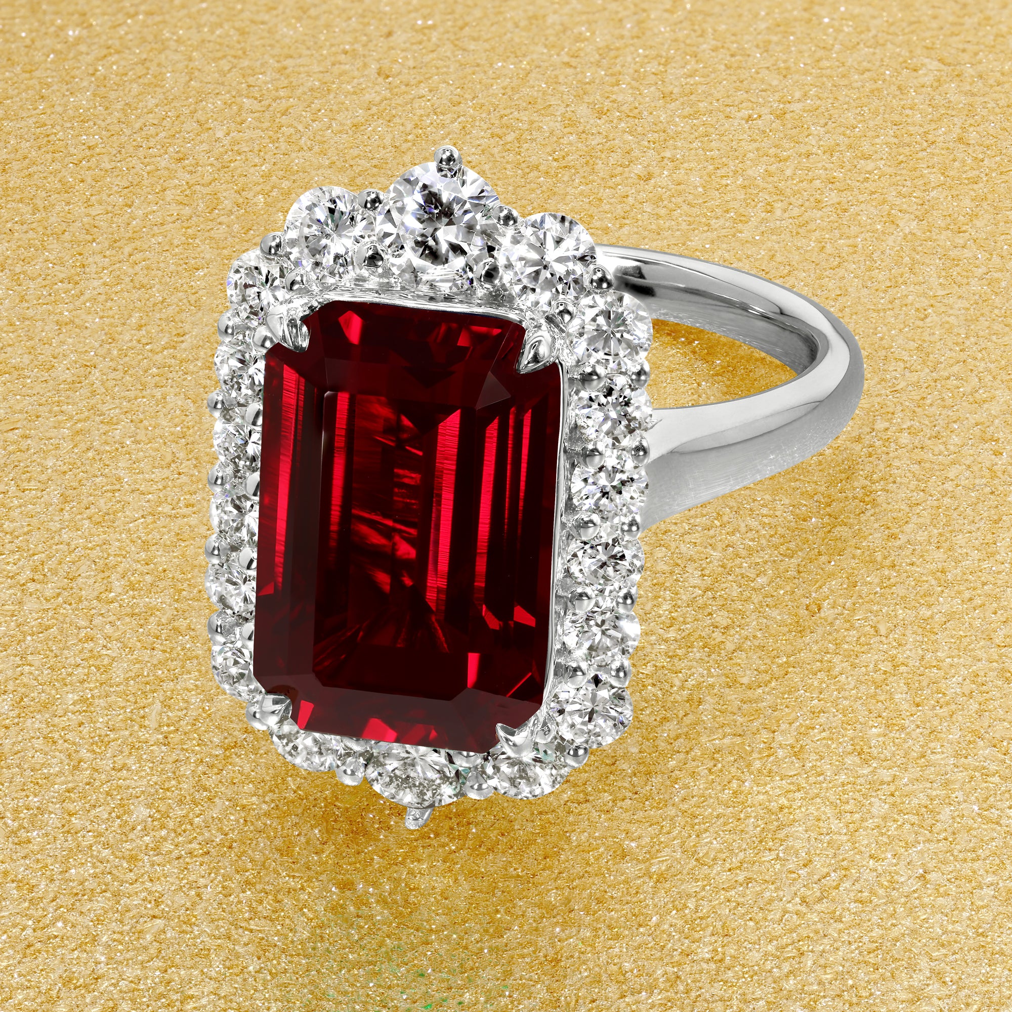 Gloria 4.5ct Emerald-Cut Lab-Grown Ruby Halo Cathedral Engagement Ring in 14K Gold, 18K Gold, or Platinum by Earthena Jewelry of Beverly Hills, California.