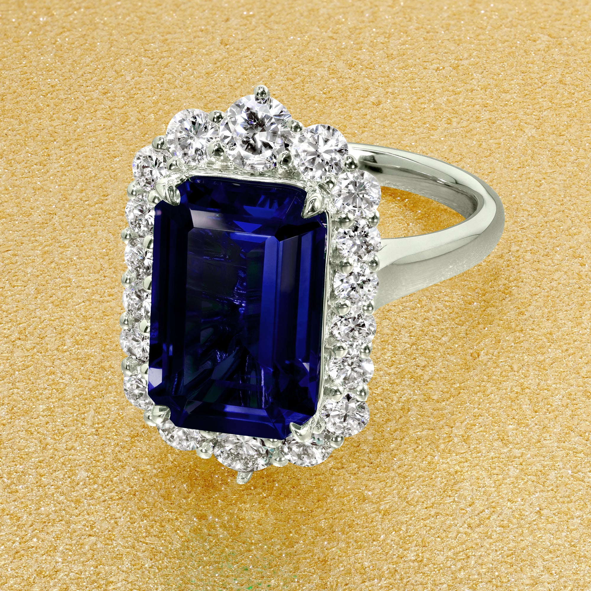 Gloria 4.5ct Emerald-Cut Lab-Grown Blue Sapphire Halo Cathedral Engagement Ring in 14K Gold, 18K Gold, or Platinum by Earthena Jewelry of Beverly Hills.