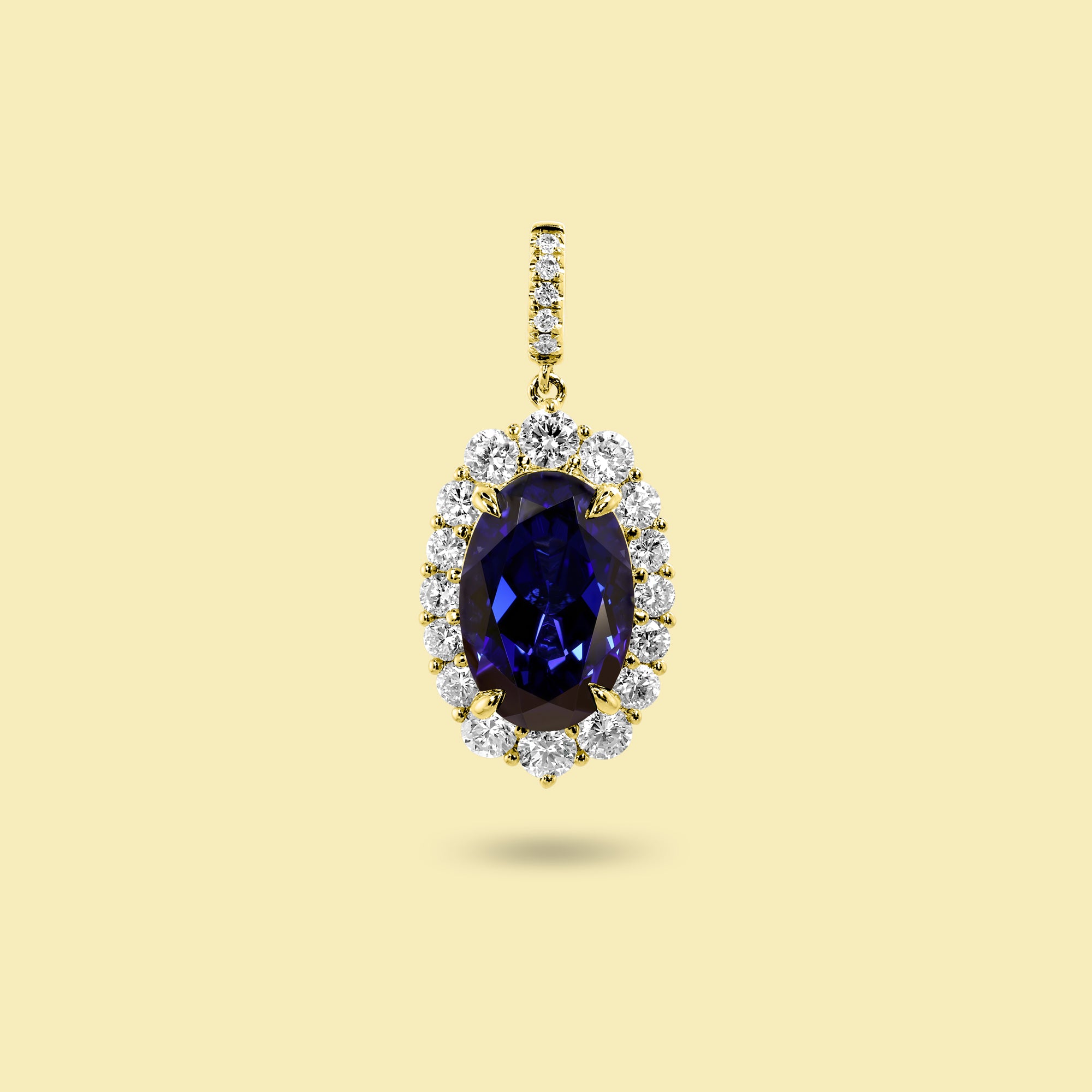 Gloria 4ct Elongated Lab-Grown Oval-Cut Blue Sapphire Halo Charm Pendant in 14K Gold, 18K Gold, or Platinum by Earthena Jewelry of Beverly Hills.