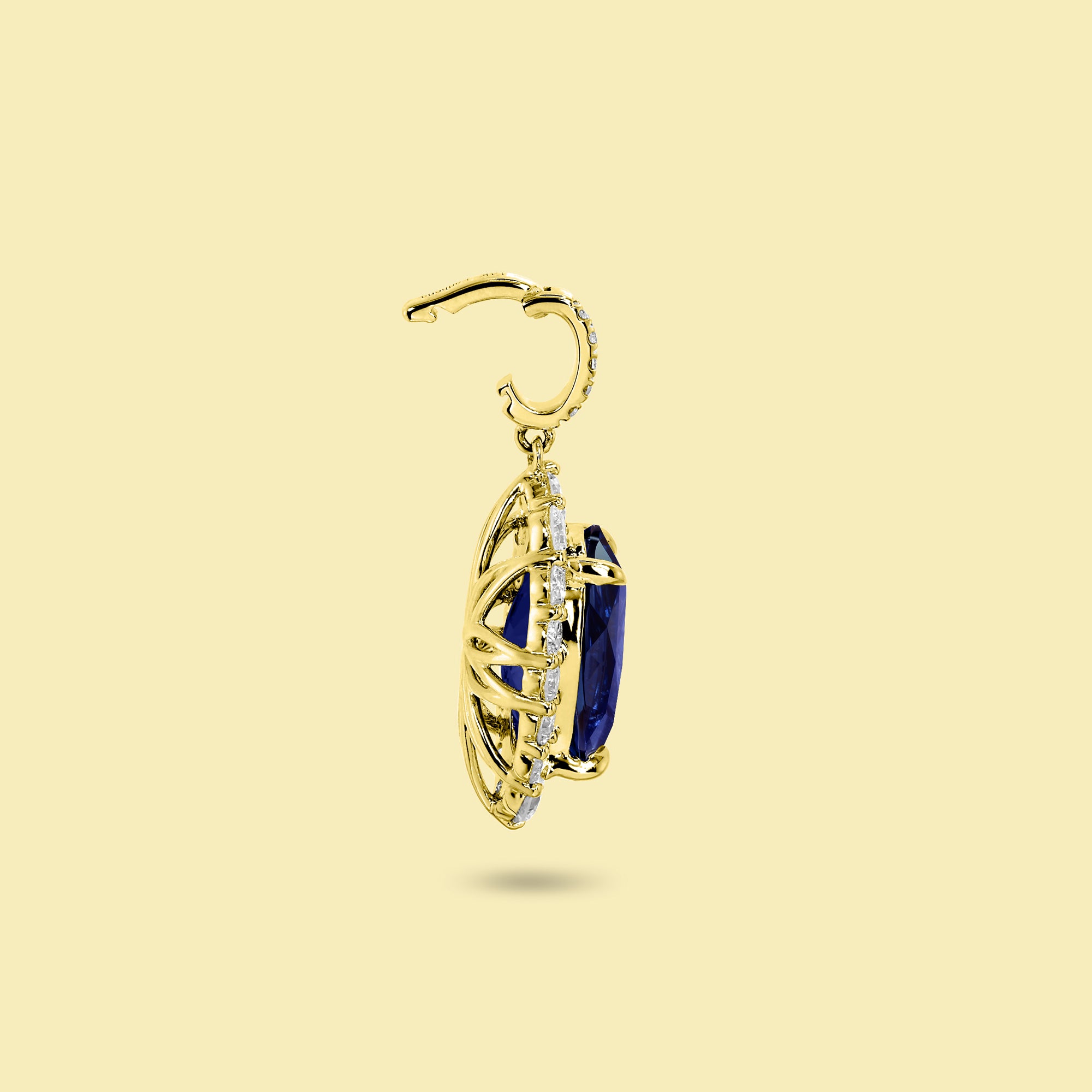 Gloria 4ct Elongated Lab-Grown Oval-Cut Blue Sapphire Halo Charm Pendant in 14K Gold, 18K Gold, or Platinum by Earthena Jewelry of Beverly Hills.