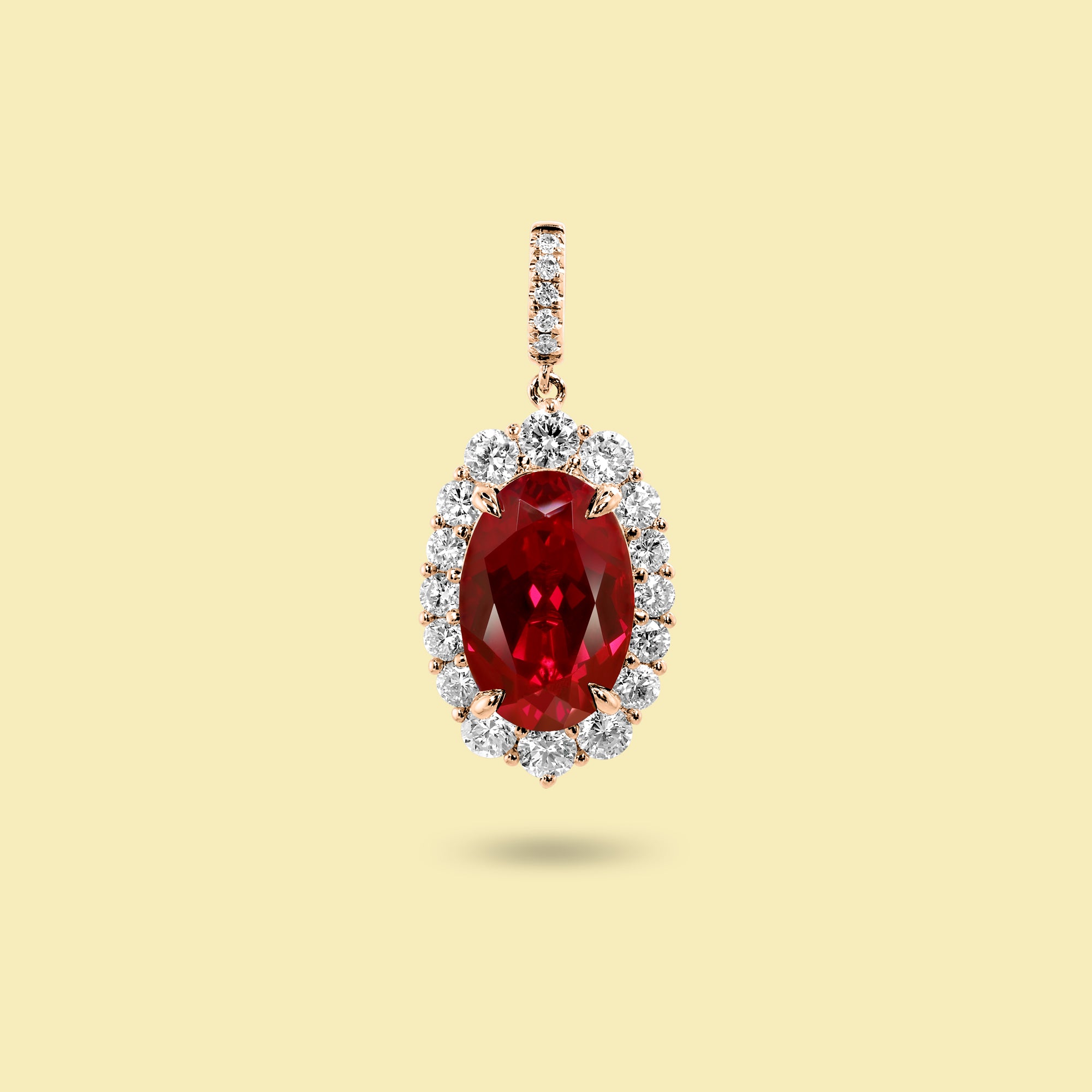 Gloria 4ct Elongated Lab-Grown Oval-Cut Ruby Halo Charm Pendant in 14K Gold, 18K Gold, or Platinum by Earthena Jewelry of Beverly Hills.
