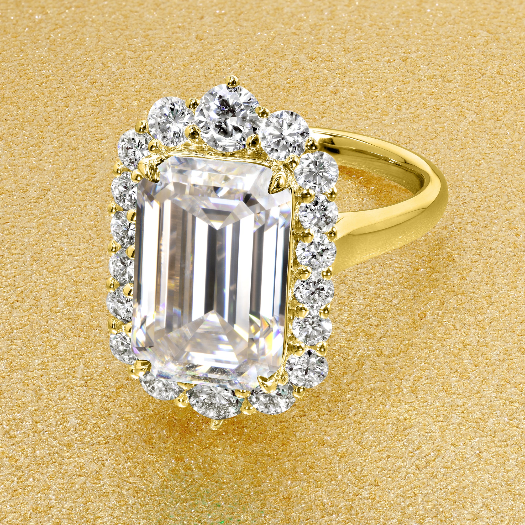 Gloria 5.5ct Elongated Emerald-Cut Moissanite Halo Cathedral Engagement Ring in 14K Gold, 18K Gold, or Platinum by Earthena Jewelry of Beverly Hills.