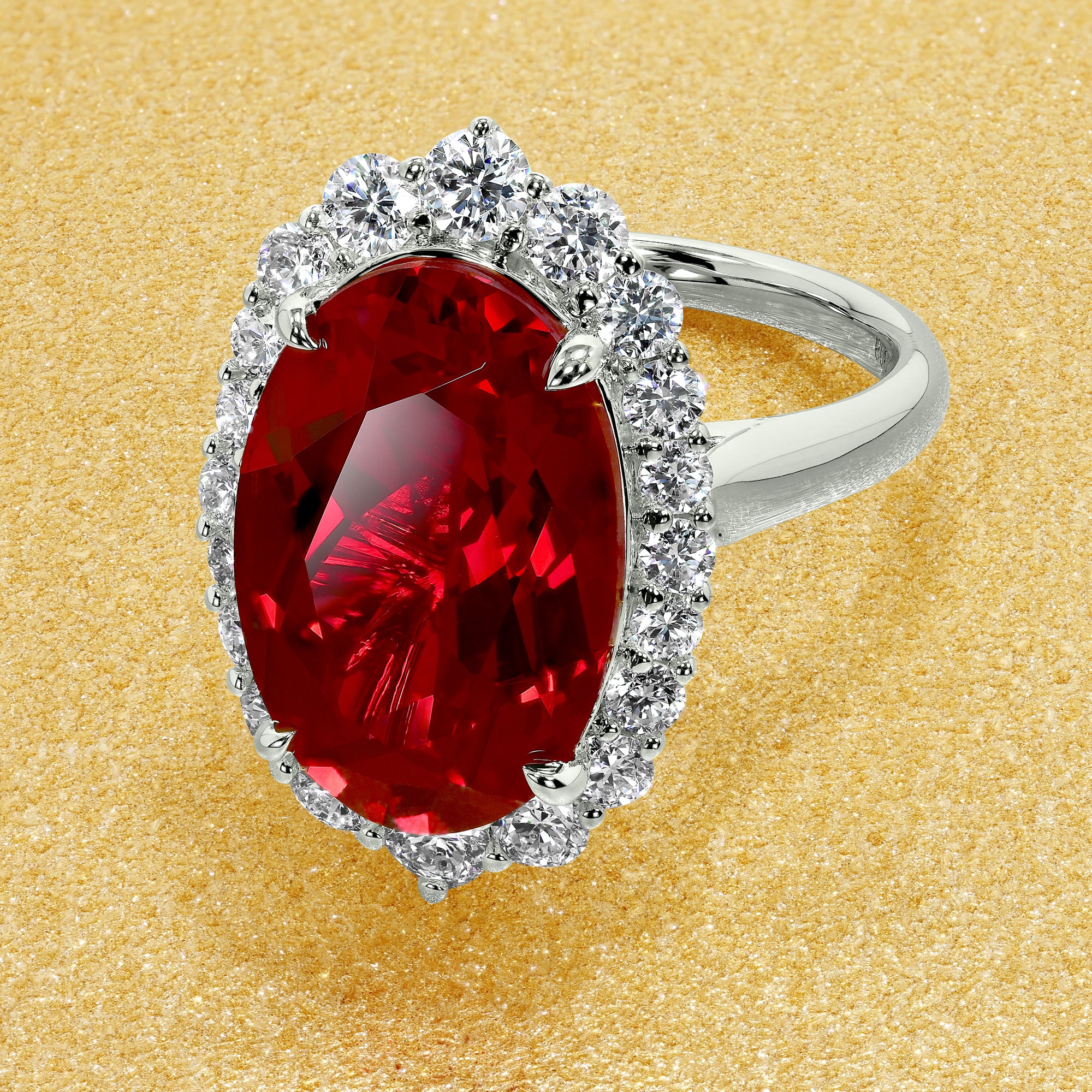 Gloria 8ct Elongated Lab-grown Oval-cut Ruby Halo Cathedral Engagement Ring in 14K Gold, 18K Gold, or Platinum by Earthena Jewelry of Beverly Hills.