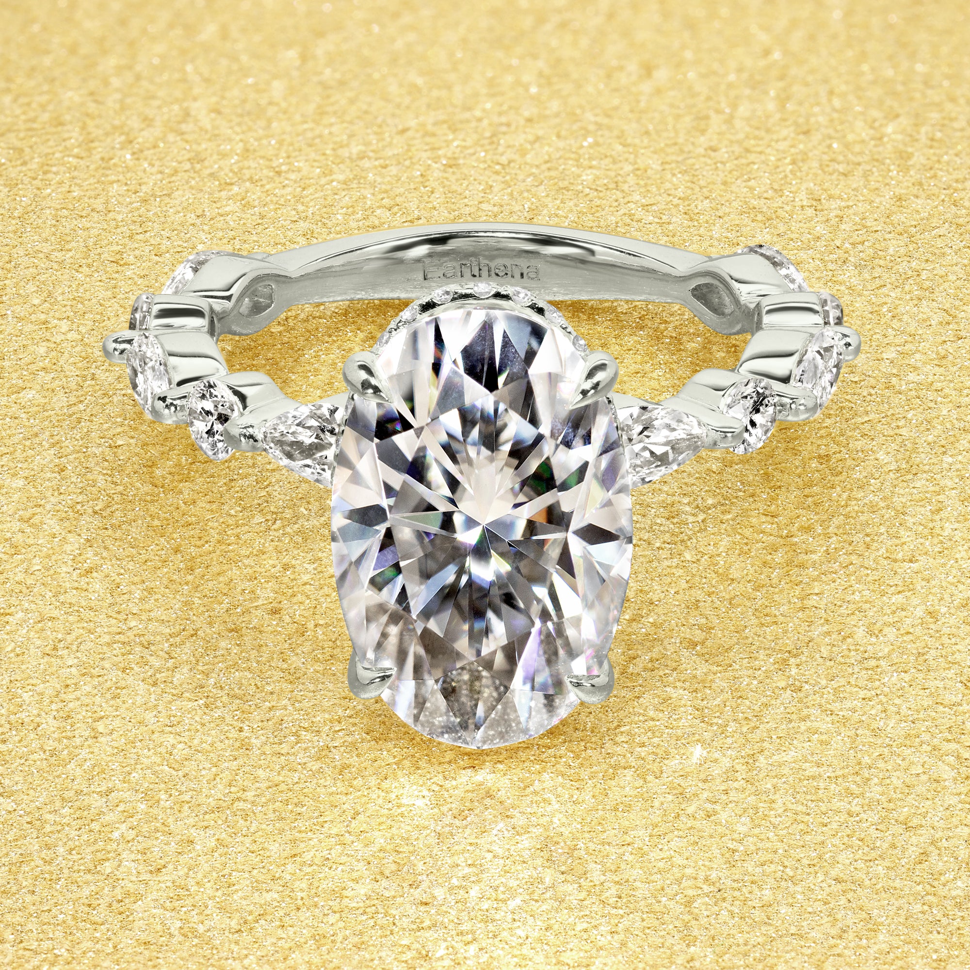 Classic Grace 4.75ct Oval Brilliant-cut Moissanite Hidden Halo Floating Marquise and Round Lab-grown Diamond Engagement ring in 14K gold, 18K gold, or Platinum handcrafted in Los Angeles by Earthena Jewelry.