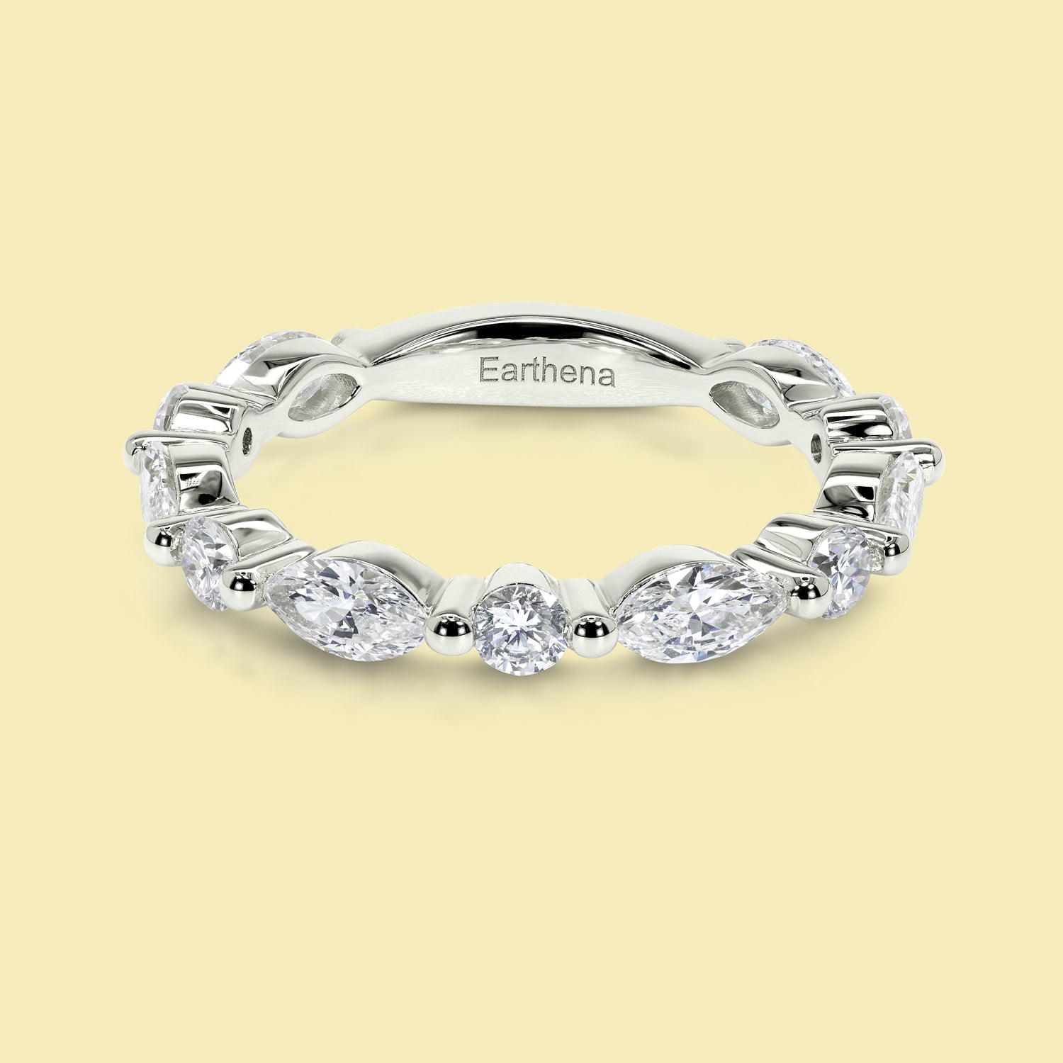 This Grace Floating Marquise and Round Brilliant-cut Diamond Semi-eternity Band is Handcrafted in 14K gold, 18K gold, or Platinum by Earthena Jewelry in Beverly Hills.