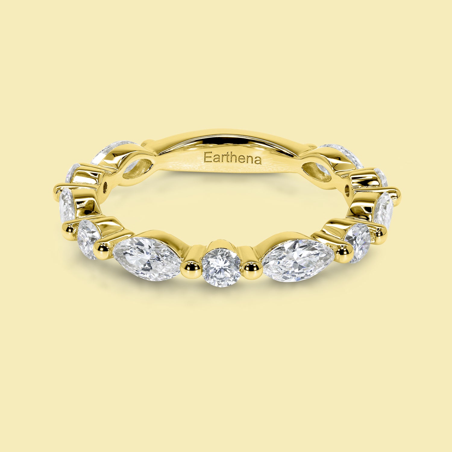 This Grace Floating Marquise and Round Brilliant-cut Diamond Semi-eternity Band is Handcrafted in 14K gold, 18K gold, or Platinum by Earthena Jewelry in Beverly Hills.