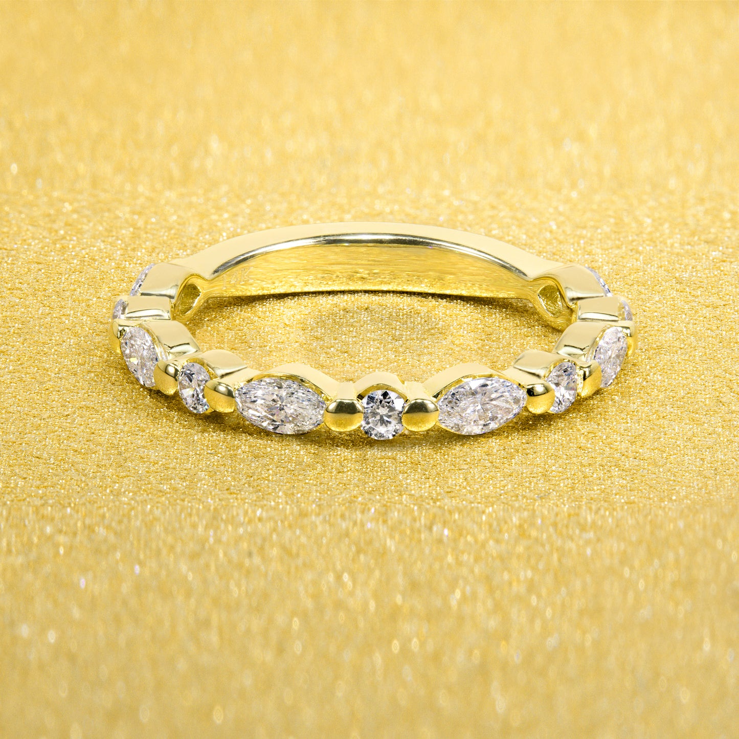 This Grace Floating Marquise and Round Brilliant-cut Lab-grown Diamond Semi-eternity Band is Handcrafted in White, Yellow, or Rose Gold with a high polish finished in 14K or 18K gold by Earthena Jewelry
