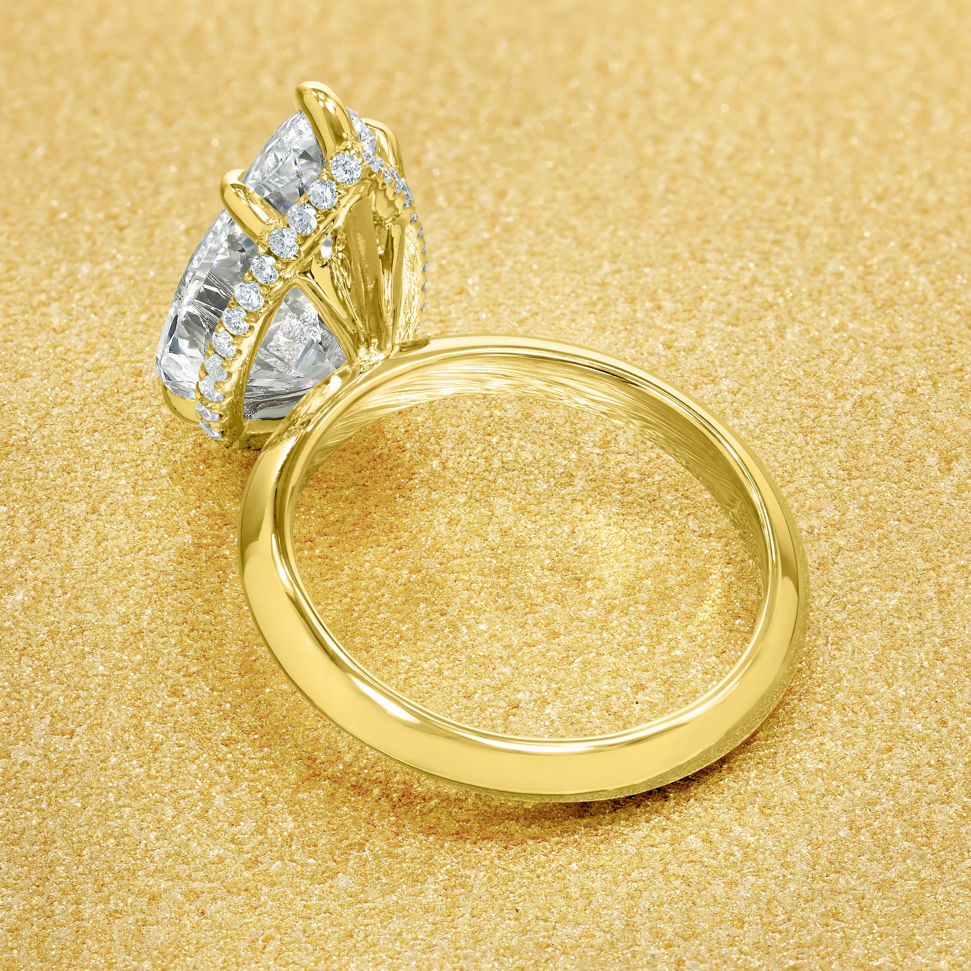 Axis 5ct Pear-Shaped Lab-Grown Diamond Knife-Edge Engagement Ring in 14K Gold, 18K Gold, or Platinum by Earthena Jewelry of Beverly Hills.