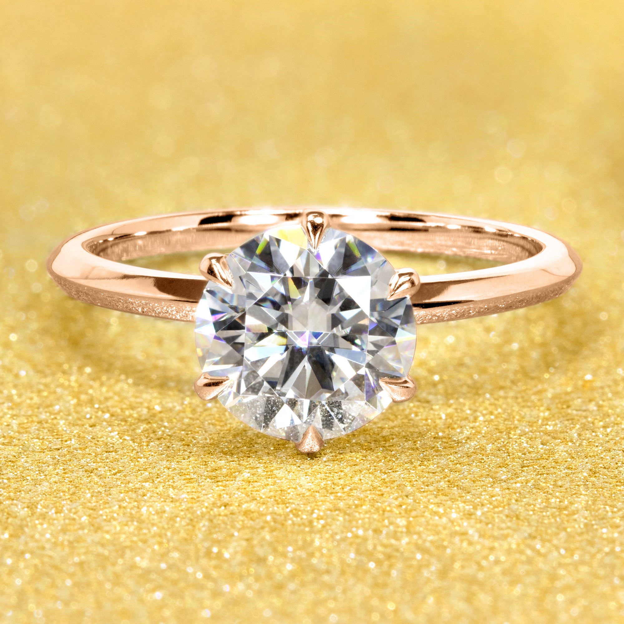 The Lexi, 2ct Round Brilliant-Cut Lab-Grown Diamond Knife-Edge Solitaire Engagement Ring in 14K Gold, 18K Gold, or Platinum by Earthena Jewelry of Beverly Hills.