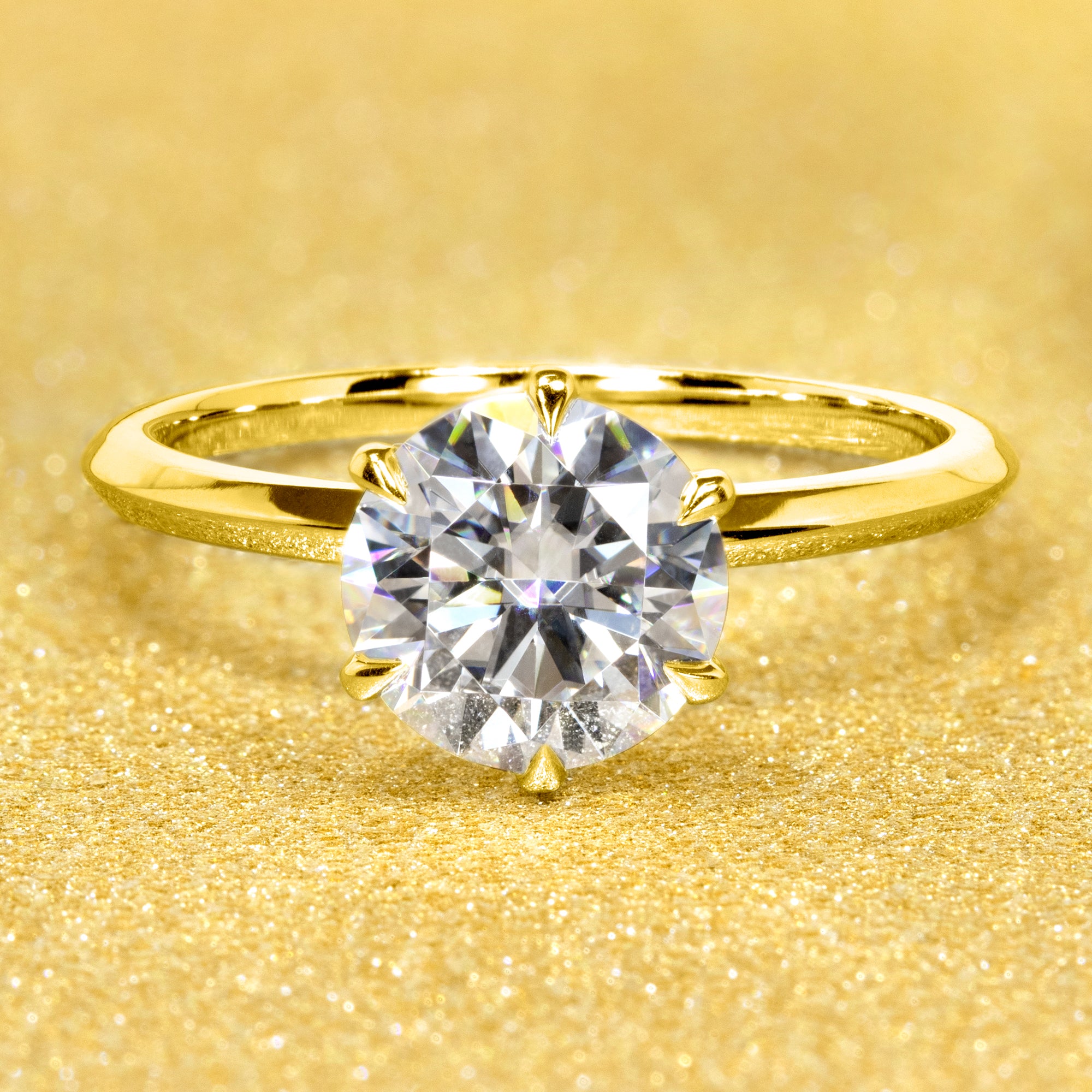 The Lexi, 2ct Round Brilliant-Cut Lab-Grown Diamond Knife-Edge Solitaire Engagement Ring in 14K Gold, 18K Gold, or Platinum by Earthena Jewelry of Beverly Hills.