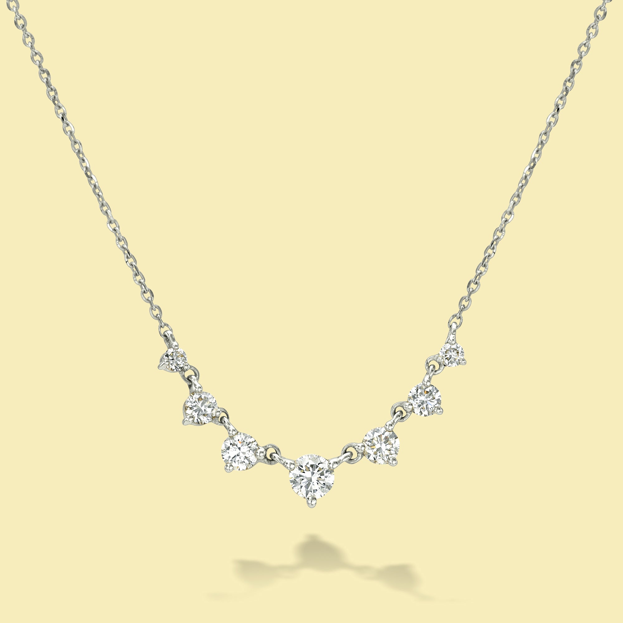 The Naomi, Graduated 7-Stone Diamond Necklace is handcrafted in 14K Gold, 18K Gold, or Platinum by Earthena Jewelry in Los Angeles