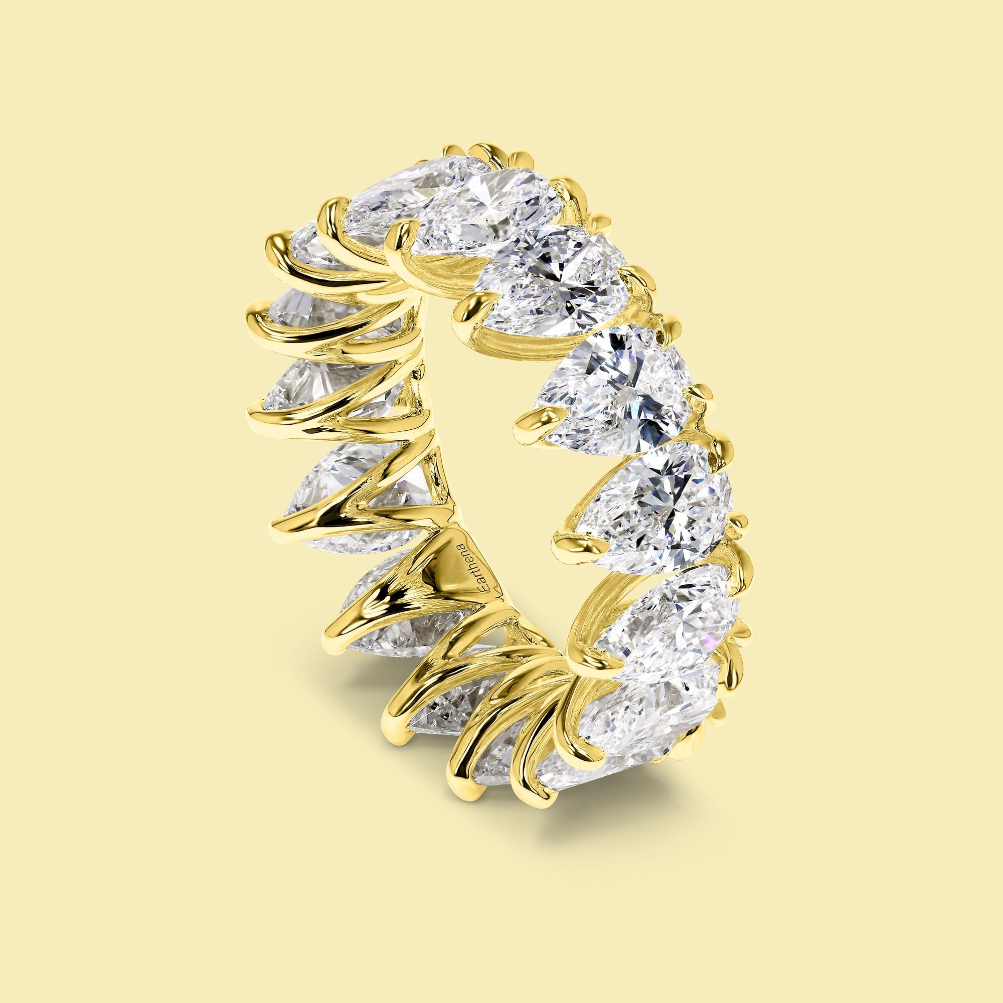 The Naomi Pear Eternity Band is handcrafted in 14K gold, 18K gold, or Platinum by Earthena Jewelry of Beverly Hills.
