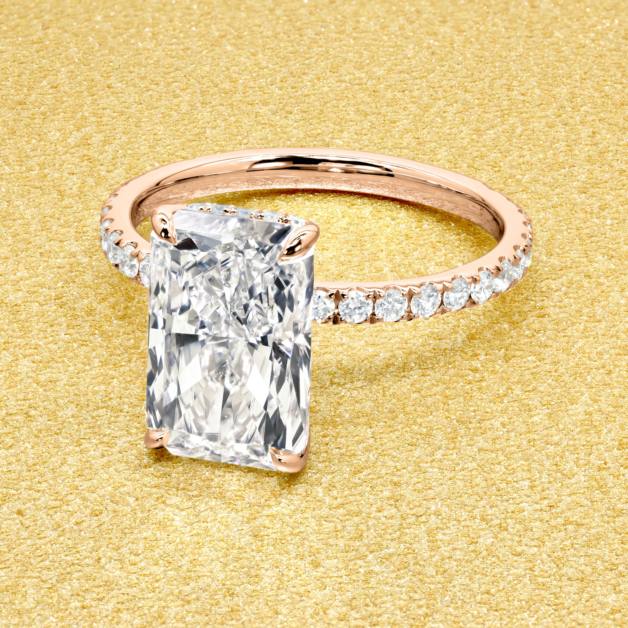 Classic Selina 3ct Elongated Radiant-Cut Lab-Grown Diamond Hidden Vow Halo Engagement Ring in 14K Gold, 18K Gold, or Platinum by Earthena Jewelry of Beverly Hills.
