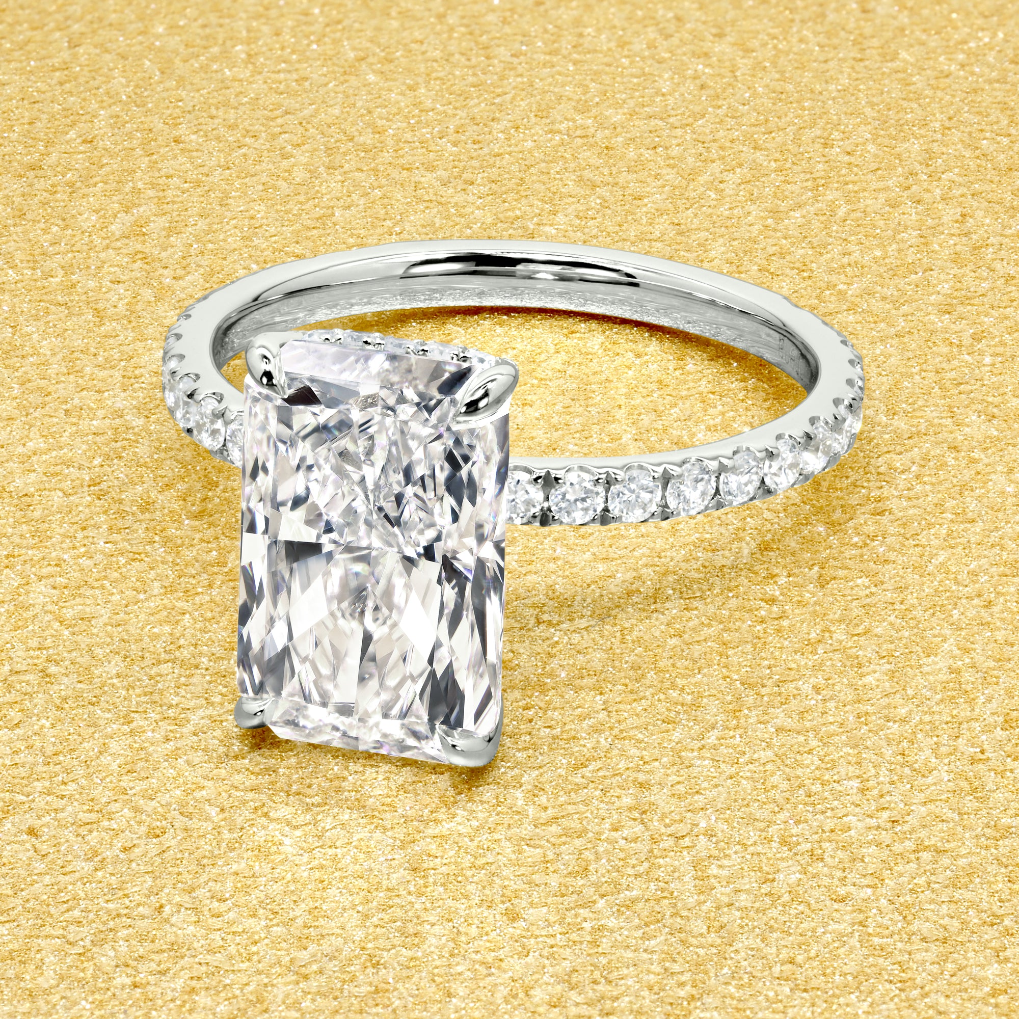 Classic Selina 3ct Elongated Radiant-Cut Lab-Grown Diamond Hidden Vow Halo Engagement Ring in 14K Gold, 18K Gold, or Platinum by Earthena Jewelry of Beverly Hills.