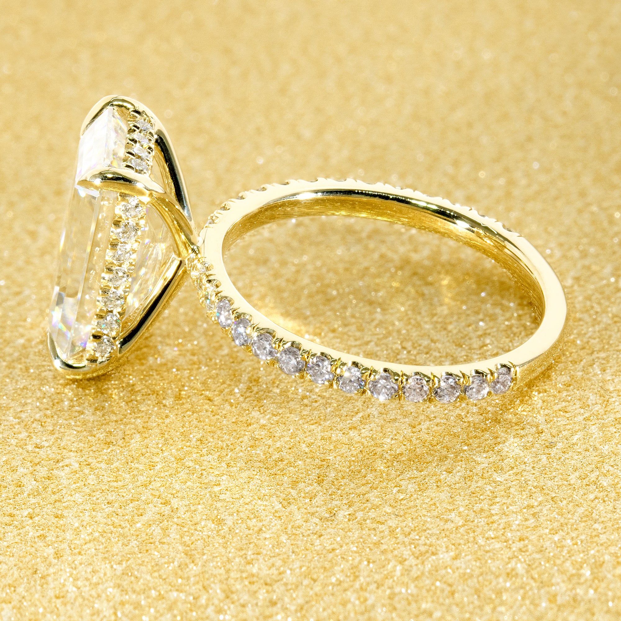 Classic Selina 5ct Elongated Emerald-Cut Lab-Grown Diamond Hidden Halo Engagement Ring in 14K Gold, 18K Gold, or Platinum by Earthena Jewelry of Beverly Hills.