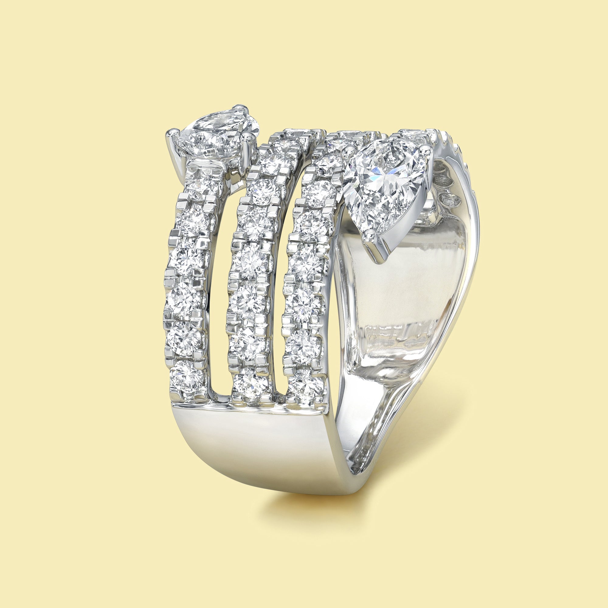 The Siya, Multi Row Bypass Diamond Band is handcrafted in 14K gold, 18K gold, or Platinum by Earthena Jewelry in Los Angeles