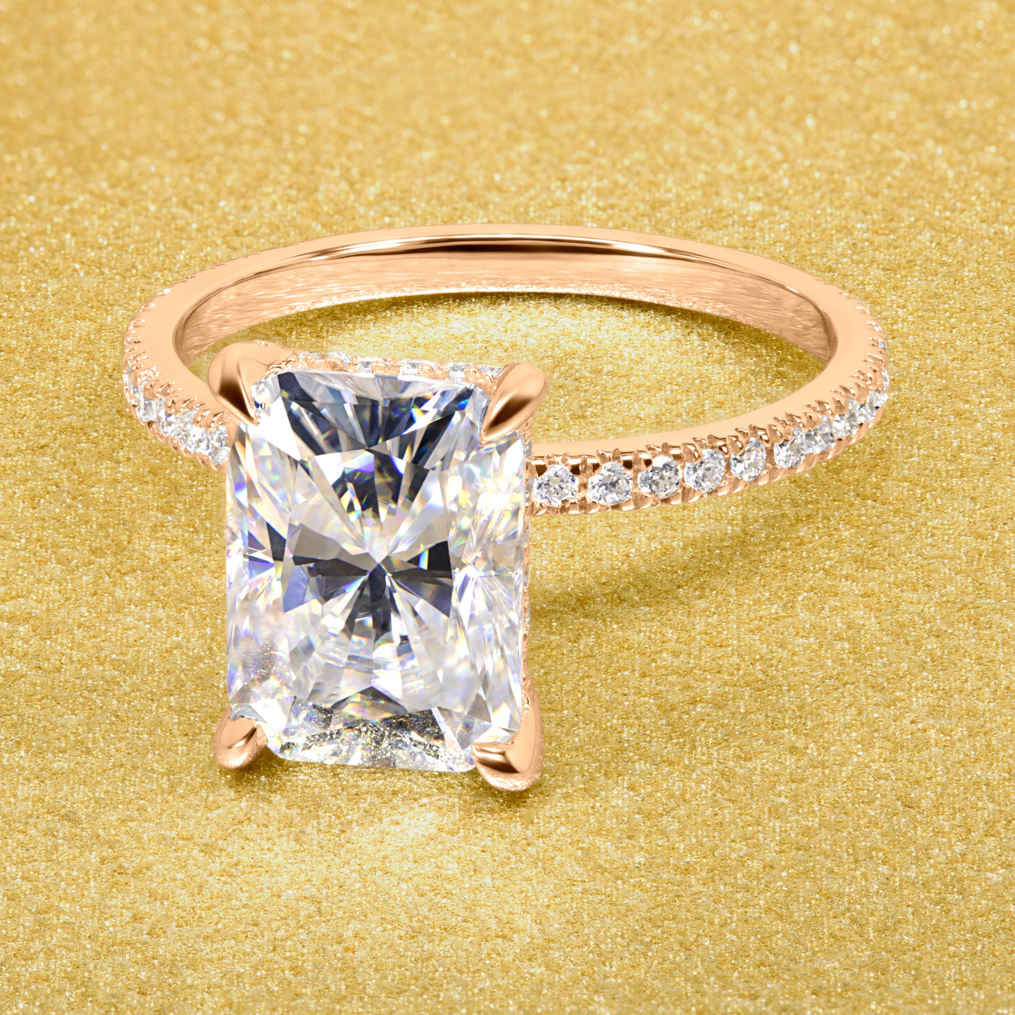 Classic Stella 3.5ct Elongated Radiant-cut Moissanite Hidden Wrap Halo and Lab-grown Diamond Engagement ring in 14K or 18K Gold handcrafted in Los Angles by Earthena Jewelry.