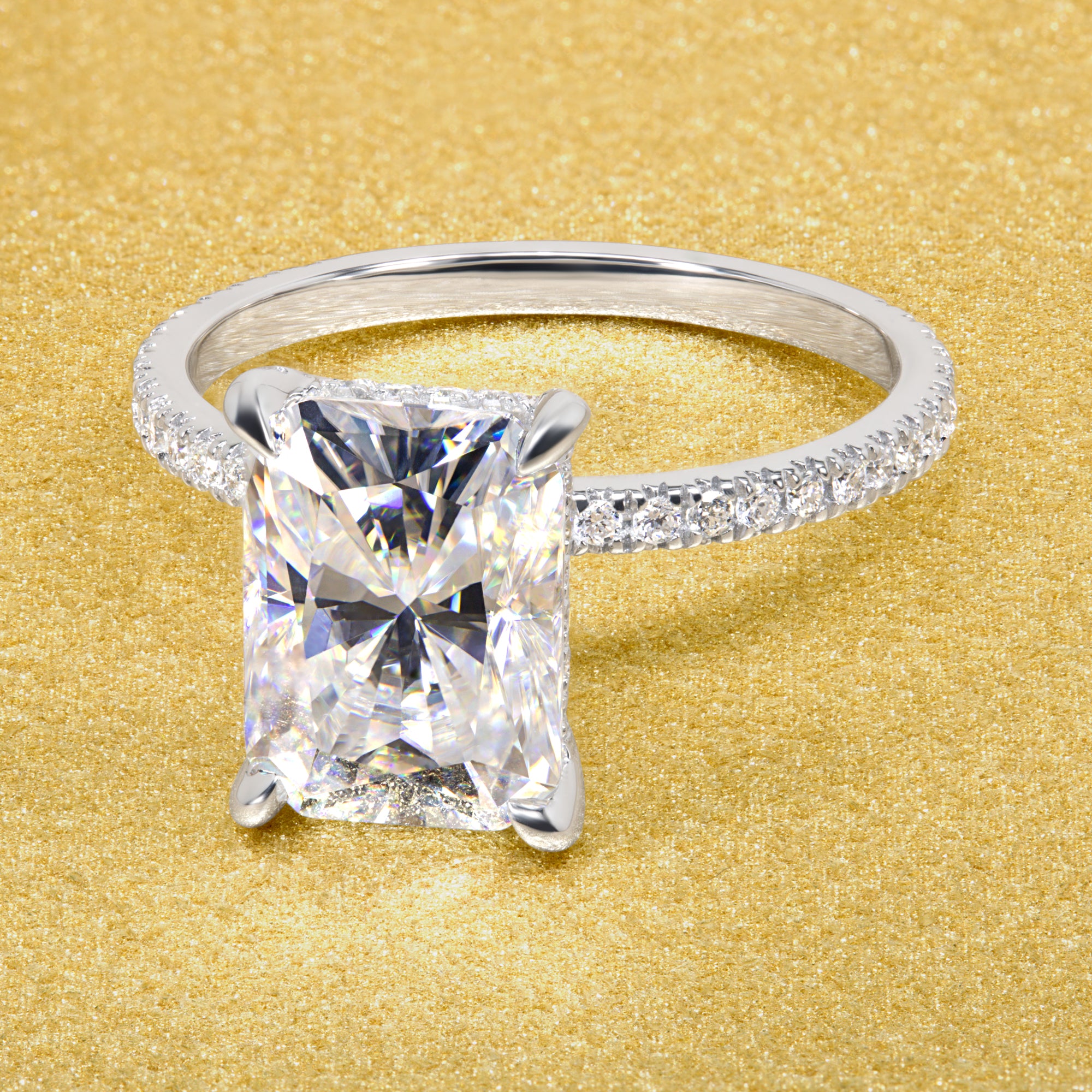 Classic Stella 3.5ct Elongated Radiant-cut Moissanite Hidden Wrap Halo and Lab-grown Diamond Engagement ring in 14K or 18K Gold handcrafted in Los Angles by Earthena Jewelry.