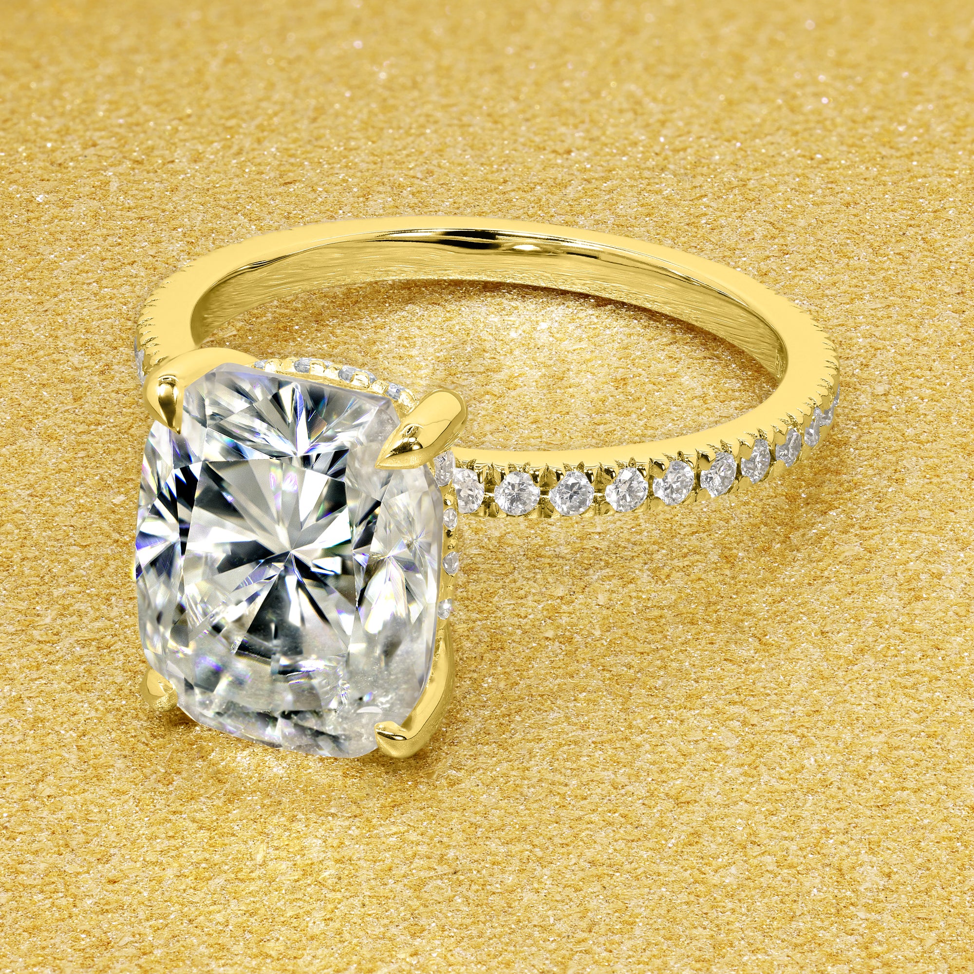 The Stella Elongated Brilliant-cut Cushion-cut Pave band Hidden Halo Moissanite Engagement Ring is a classic look with an elegant twist complemented by Moissanite stones handcrafted in 14K Gold, 18K Gold, or Platinum handcrafted in Los Angeles by Earthena Jewelry.