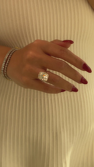 The Adara Elongated Old Mine Cushion-cut Hidden Halo Moissanite Engagement Ring, a classic look with an elegant twist complemented by Lab Diamonds handcrafted in 14K gold, 18K gold, or Platinum by Earthena Jewelry of Beverly Hills.
